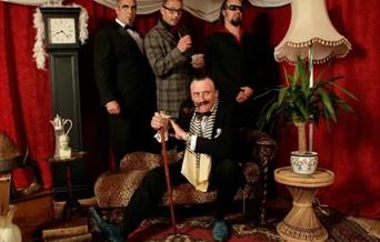 Photograph of The Randy Swindles dressed in costumes.