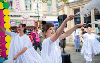 Dancers spinning with costumes.