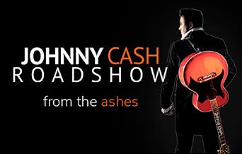 Johnny Cash with guitar from the rear