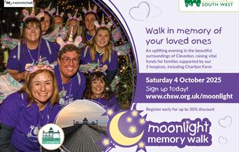 People smiling and in fancy dress at the Moonlight Memory Walk event