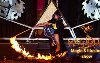Magique at Wookey Hole - photograph of a fire artist.
