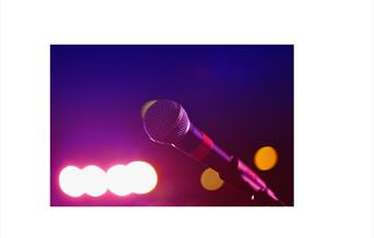 image of a microphone on a purple background