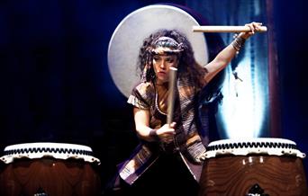 Photograph of Taiko Drummer playing two drums