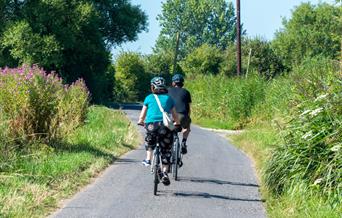 Two cyclists on a pretty cycle route