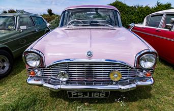 A pink vintage vehicle at the Weston-super-Mare Pageant of Transport