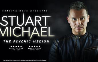 Stuart Michael on the right and the title in white glowing on the left.