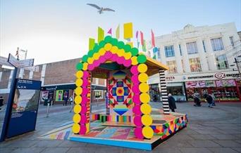 Photograph of the brightly coloured Super Wonder Shrine