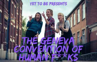 The Geneva Convention of Human F**ks team standing in a street.
