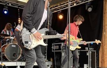 2 Guitar players and drummer