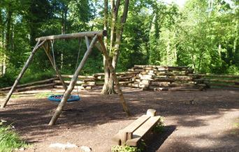 Swings and wooden bench