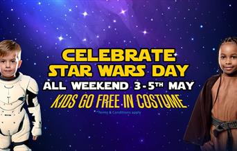 Two children in Star Wars costumes on a starry background advertising an event in May when children get free entry to Wookey Hole if they're wearing a