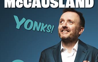 Photo of comedian Chris McCausland wearing a suit jacket and open necked white shirt on a poster advertising his stand-up show Yonks