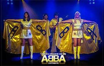 abba inspired clothing, posing upon stage