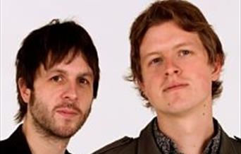 Mug shots of band members Adam and Alex Lipinski taken against a white background