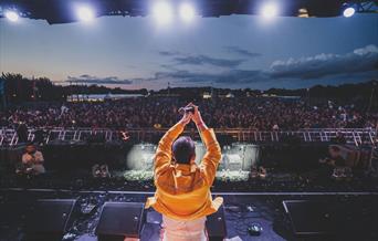 Rear view of Freddie Mercury lookalike on stage