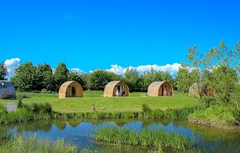 Wall Eden Farm Adventure Holidays Self Catering Visit Weston-super-Mare pod exterior river blue sky