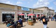 Exterior of a cafe with tables