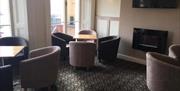 The Royal Grosvenor Hotel Visit Weston-super-Mare lounge interior chairs fireplace TV