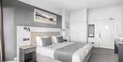Modern hotel double bedroom in white and grey decor