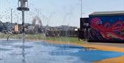 An empty water park with the splash pad jets on