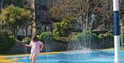 A child playing in a waterpark