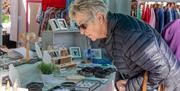 A lady browsing the jewellery store at the Weston-super-Mare weekly market
