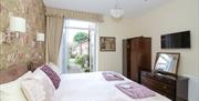 The Beach House bedroom in the ground floor apartment