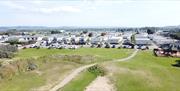 Aerial view of a holiday park and sand dunes