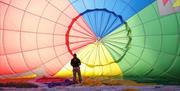 Person inside a hot air balloon at Bristol Balloon Fiesta Launch