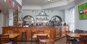 CJ's Bar at the Royal Hotel with no people and Sky Sports TV
