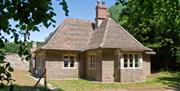 Exterior of a one-storey former hunting lodge now holiday cottage