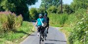 Two cyclists on a pretty cycle route