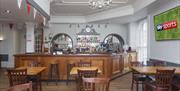 Interior of a bar with no customers inside