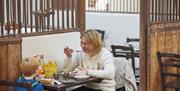 Mother and son having lunch in a cafe