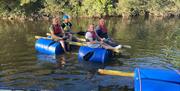 Four people on board a home made raft