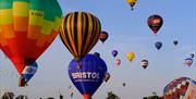 Hot air balloons taking off at Bristol Balloon Fiesta