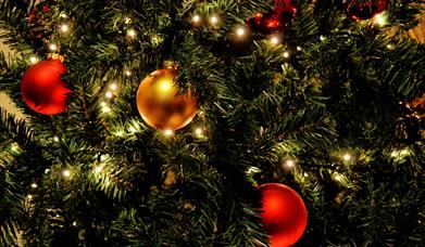 Christmas baubles and lights on a tree