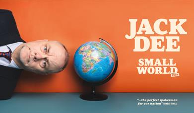 Picture of comedian Jack Dee lying on his side with his head close to a globe to advertise his Small World tour