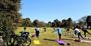 Yoga in Ellenborough Park West on a bright sunny morning