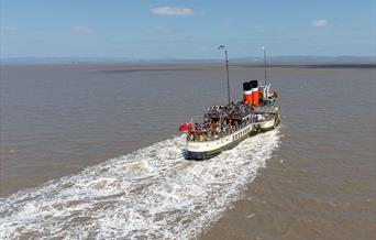 A paddle steamer out at sea