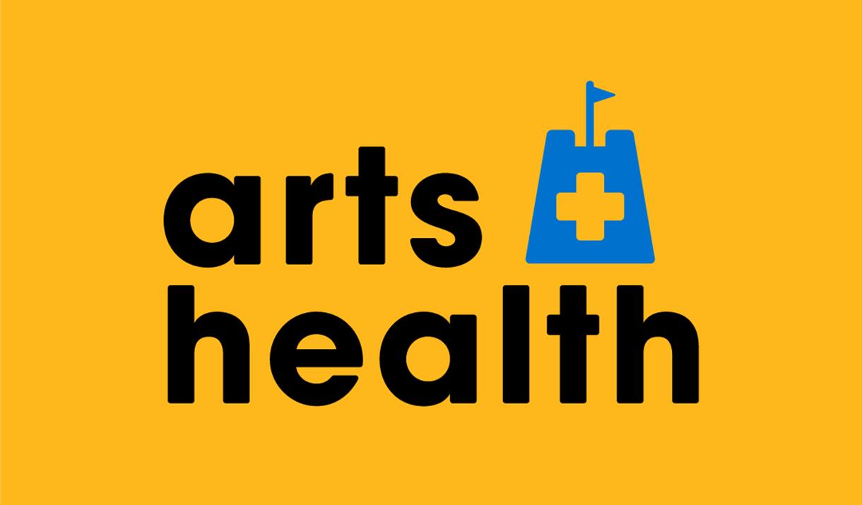 The words Arts + Health in black on a yellow background