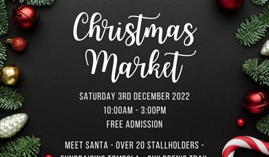 A poster with details of the market surrounded by baubles and pine leaves