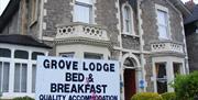 Grove Lodge Guest House exterior sign