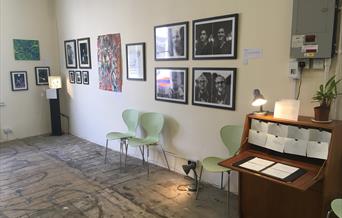 Exhibition space with artwork on the walls