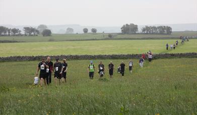 Walkers in a previous Mendip Challenge tackling the outdoors!