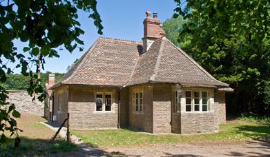 Exterior of a one-storey former hunting lodge now holiday cottage