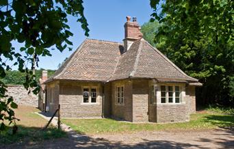 Exterior of a one-storey former hunting lodge now holiday cottage