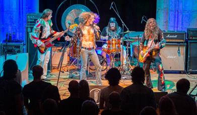 Led Zeppelin Tribute band performing on stage.