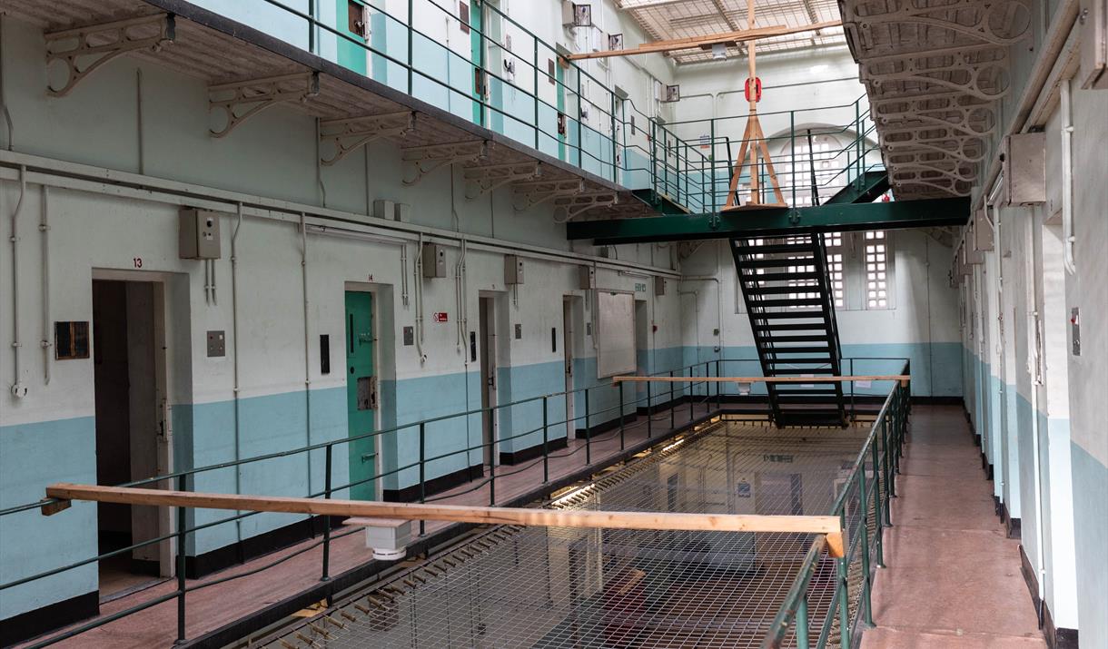 A three-storey prison wing with cells on both sides