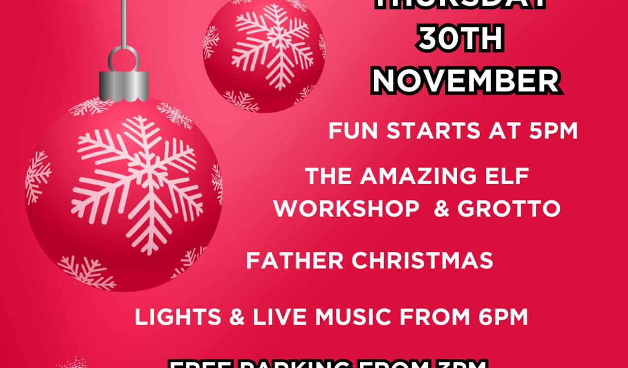 Poster with red and white baubles advertising a Christmas lights switch on